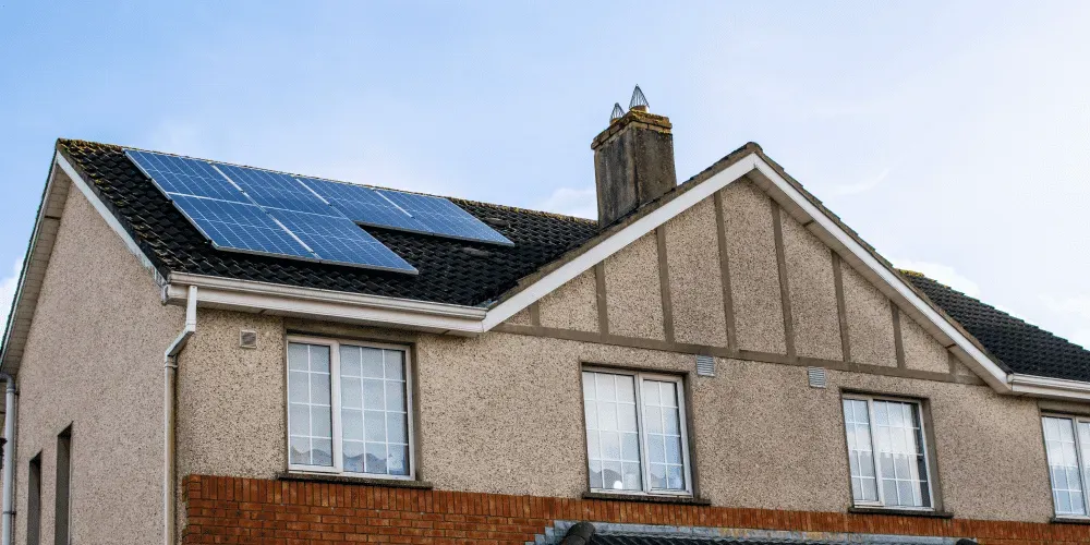 House with solar panels installed on roof.